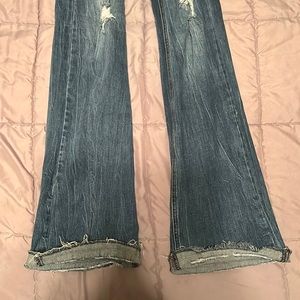 blue ripped flare jeans